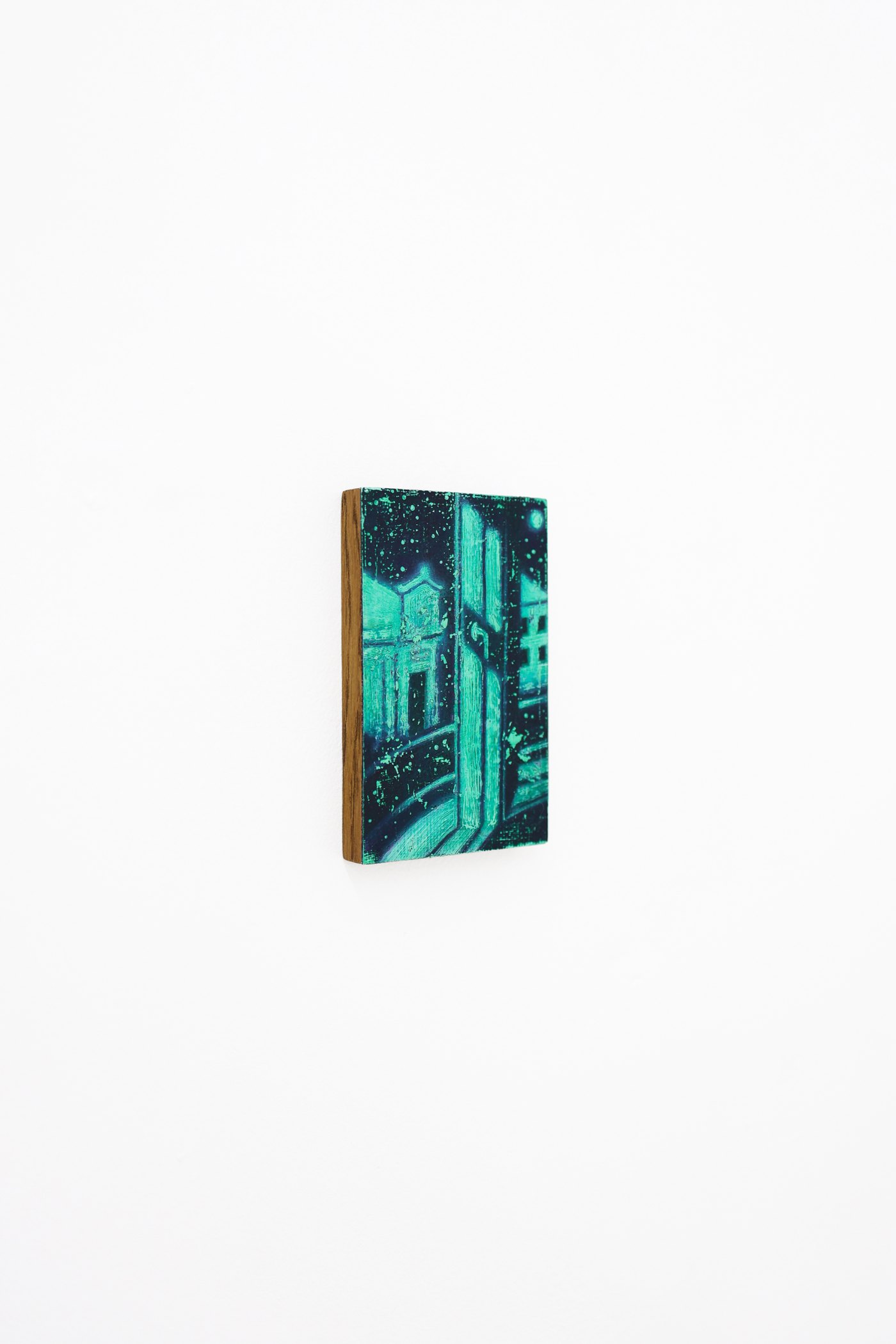 Mtatsminda Turn 1. Angled view of the small painted panel on a white wall.