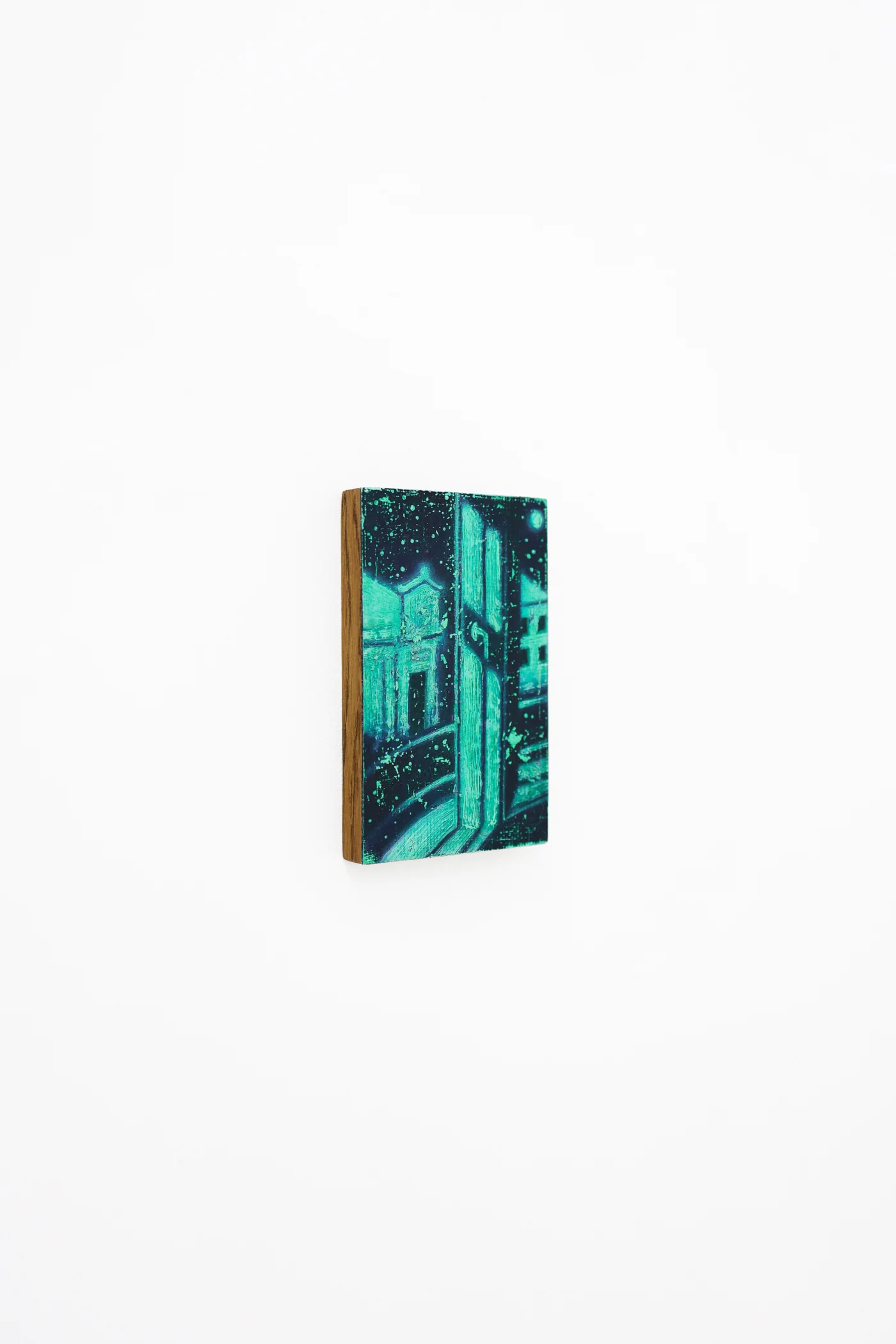 Mtatsminda Turn 1. Angled view of the small painted panel on a white wall.