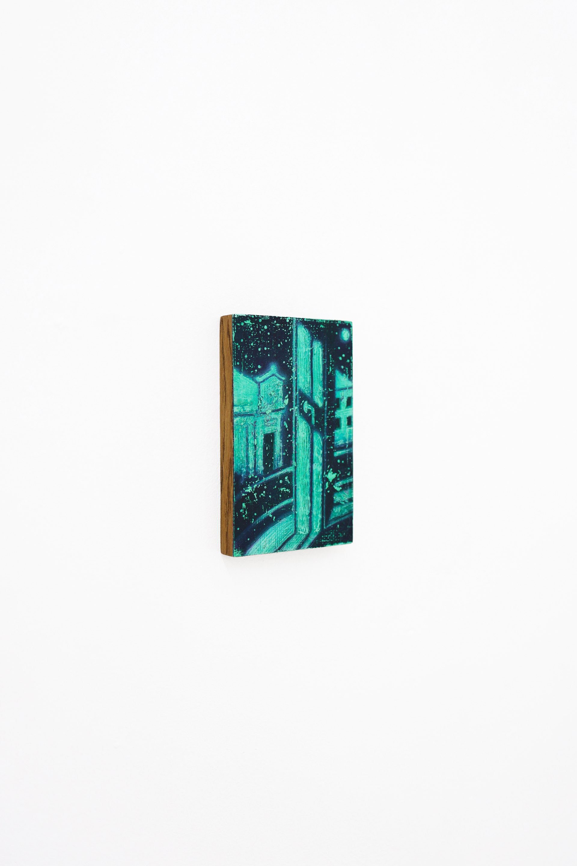 Mtatsminda Turn 1. Angled view of the small painted panel on a white wall.