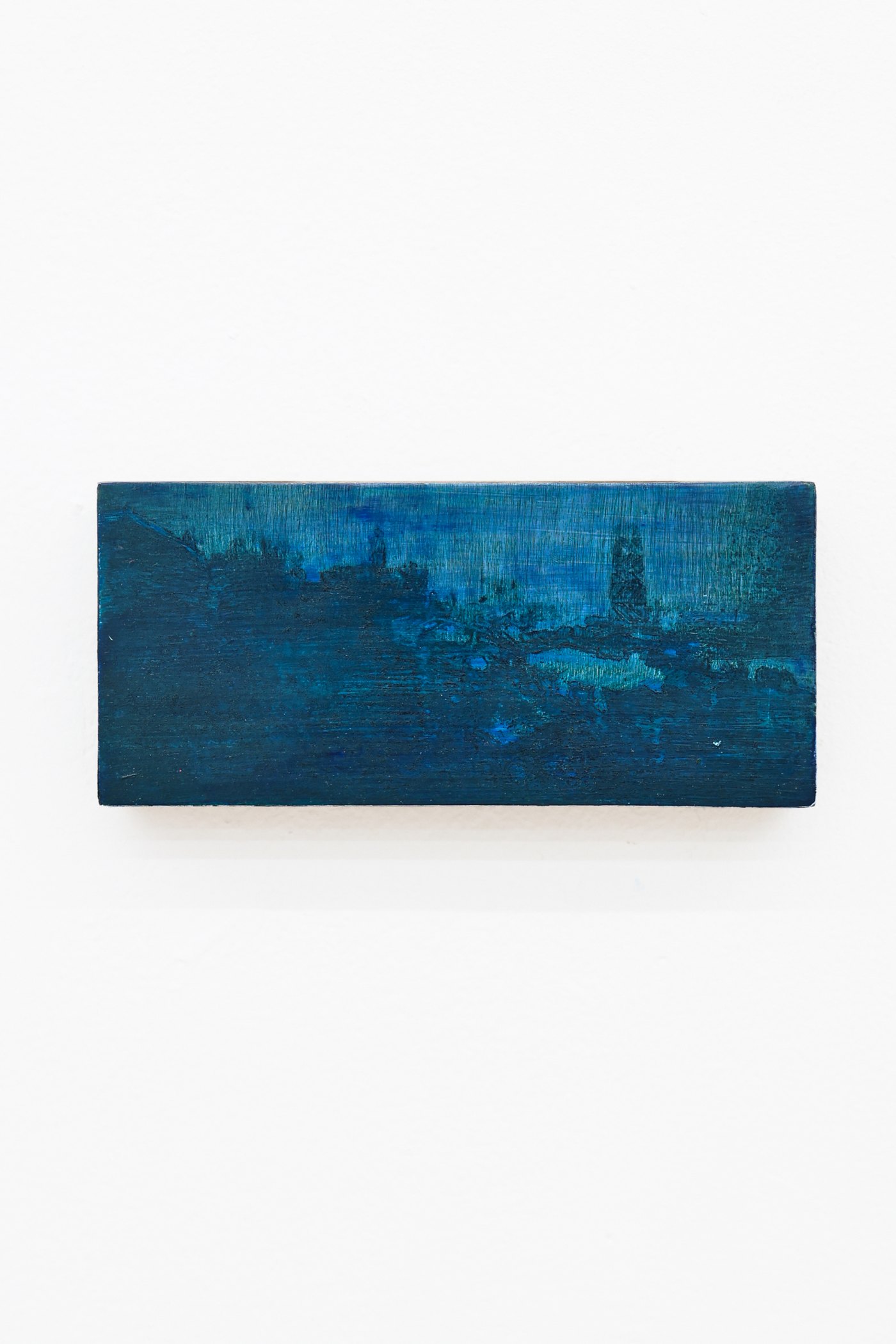 Mtatsminda Turn 10. Small horizontal night painting on an oak block, a hazy hillside skyline in deep navy and cobalt blue.