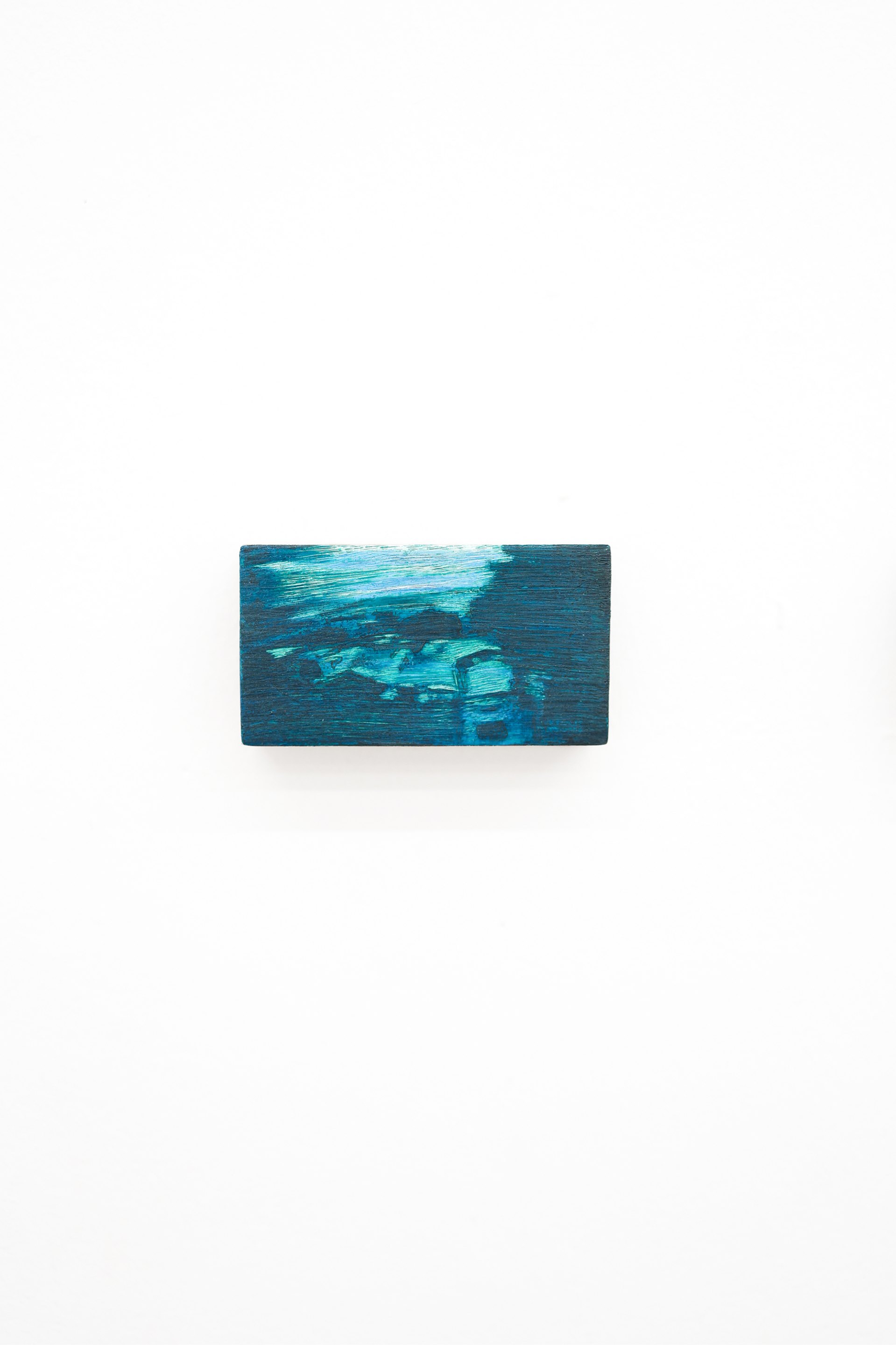 Mtatsminda Turn 3. Abstract nocturne on an oak block, dark navy-teal with a luminous turquoise streak and shadowy forms below.
